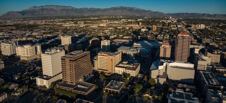 Aerial view of Albuquerque skyline at sunset. 