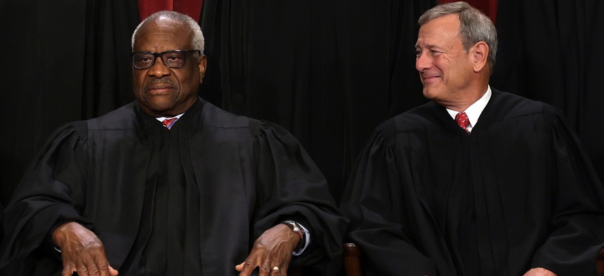 U.S. Supreme Court Chief Justice John Roberts, right, and Justice Clarence Thomas are part of the court's conservative majority that struck down the Chevron doctrine.