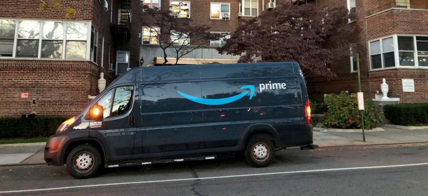 Amazon Prime delivery van outside apartment building, Queens, New York. 