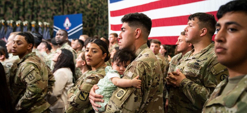 Service members and their families listen as President Joe Biden and First Lady Jill Biden speak in support of Joining Forces, the initiative to support military and veteran families, caregivers and survivors on June 9, 2023, at Fort Liberty, North Carolina.