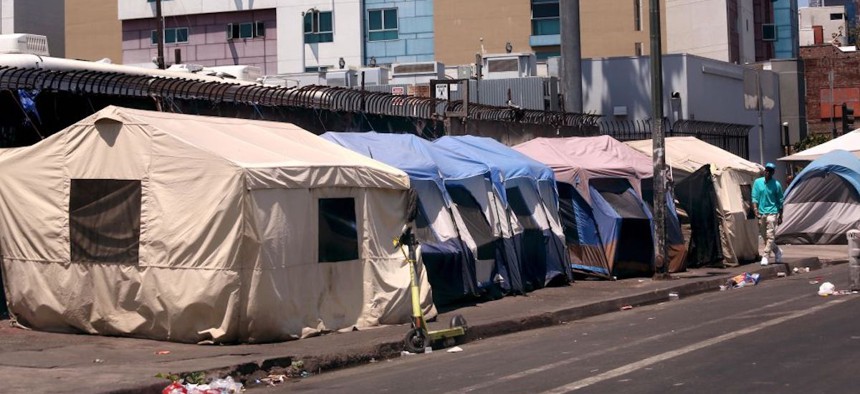 Tents line up in a row along 5th Street where unhoused individuals live in Skid Row in downtown Los Angeles on June 28, 2024.