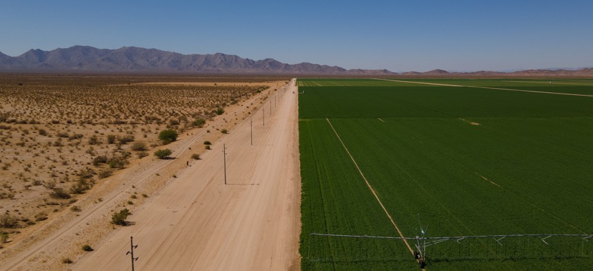 An irrigation system waters an alfalfa field at the Fondomonte farm in Butler Valley, Arizona on Monday, June 27, 2023.