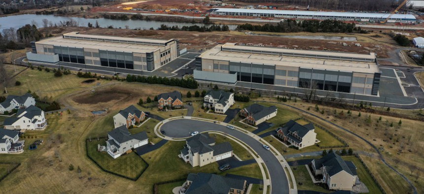 Amazon data centers have been built as close as 50 feet from residential houses in the Loudoun Meadows neighborhood on Jan. 20, 2023, in Aldie, Virginia.