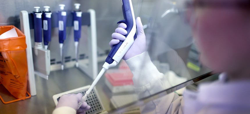 Microbiologist tests samples for bird flu at the Wisconsin Veterinary Diagnostic Laboratory at the University of Wisconsin-Madison.