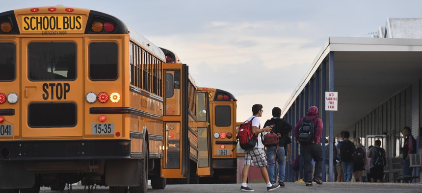 Students arrive for the first day of school at Warren High School on August 21, 2019, in Vincent, Ohio.