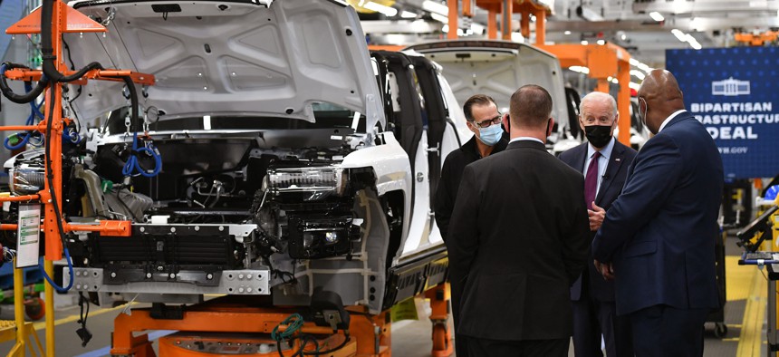 President Joe Biden tours a General Motors electric vehicle assembly plant in Detroit on November 17, 2021. 