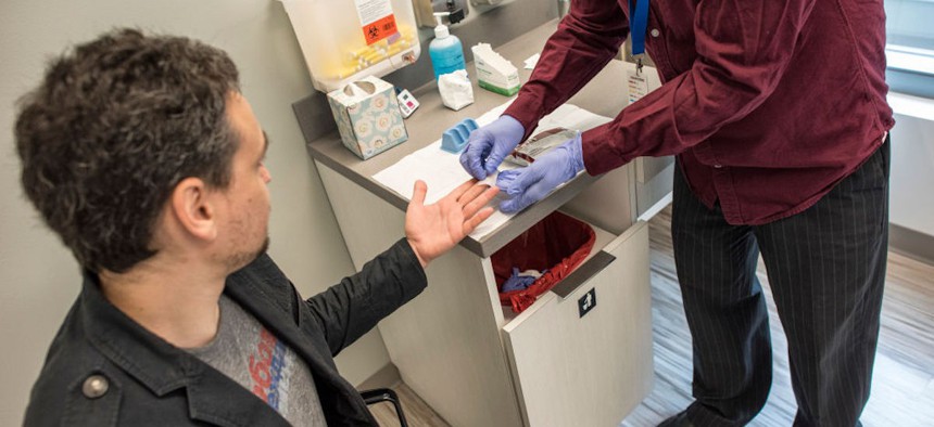 A man receives an HIV test at the Whitman Walker Clinic in Washington, D.C.