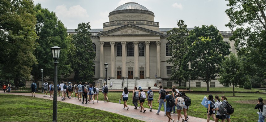 People walk on the campus of the University of North Carolina Chapel Hill on June 29, 2023, in Chapel Hill, North Carolina. 