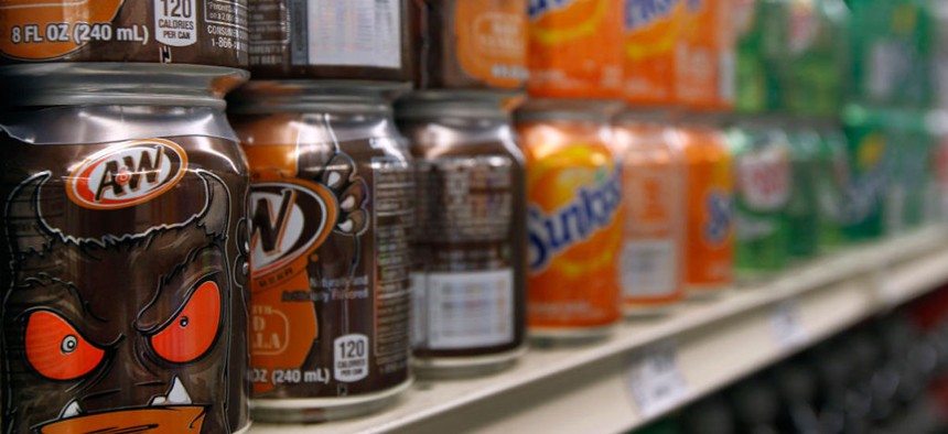 Soft drinks are displayed on shelves at the Berkeley Bowl West market in Berkeley, California, on Thursday, Nov. 6, 2014. Berkeley voters will once again vote on a ballot measure that would levy a tax on sugar-sweetened drinks like soda.