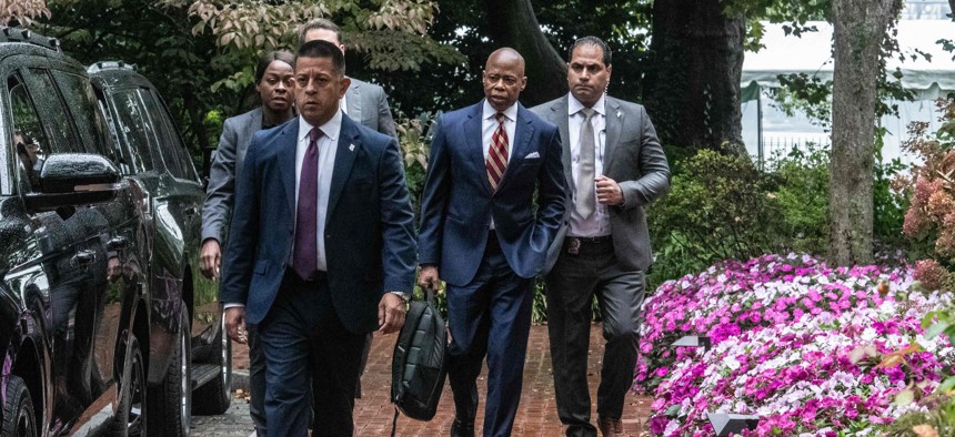 New York City Mayor Eric Adams exits Gracie Mansion on Thursday after federal prosecutors charged him with wire fraud, bribery, solicitation of a contribution by a foreign national and related crimes.