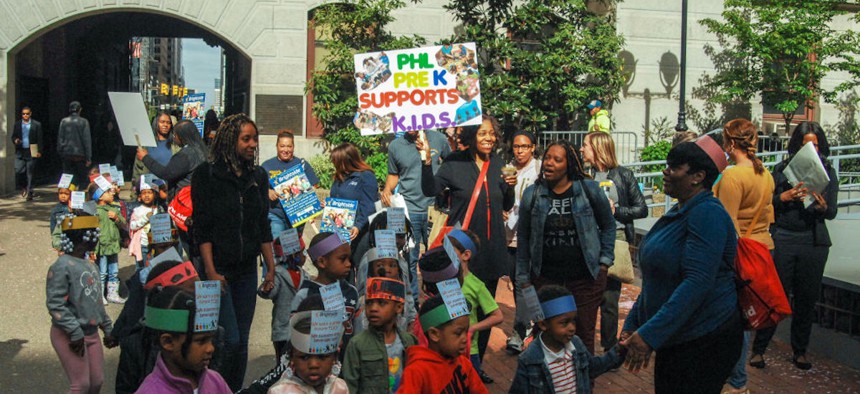 Preschool students, their teachers and parents demonstrate their support for Philadelphia's soda tax, which they say helps low-income children prepare for kindergarten. 