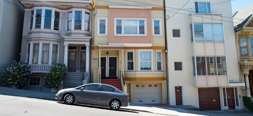 Three homes in a row on a steep hill on Fillmore Street in San Francisco. In November, Californians will vote on Proposition 33, a proposed repeal of the state’s restrictions on local rent control.