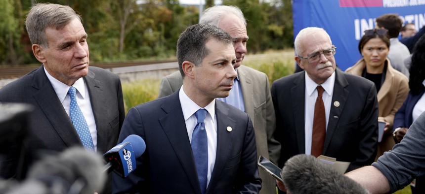 U.S. Secretary of Transportation Pete Buttigieg speaks to reporters after a groundbreaking ceremony for the Long Bridge Project in Arlington, Virginia. 