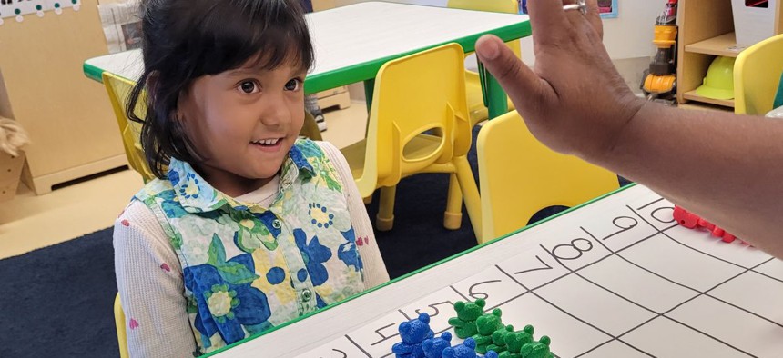  Mayeda Alan, 4, learns about counting and adding by lining up colored bears at the George Forbes Early Learning Center near Cleveland, Ohio. Using objects like the bears is a common strategy for helping students learn that a number stands for real things and is not just a word and symbol.