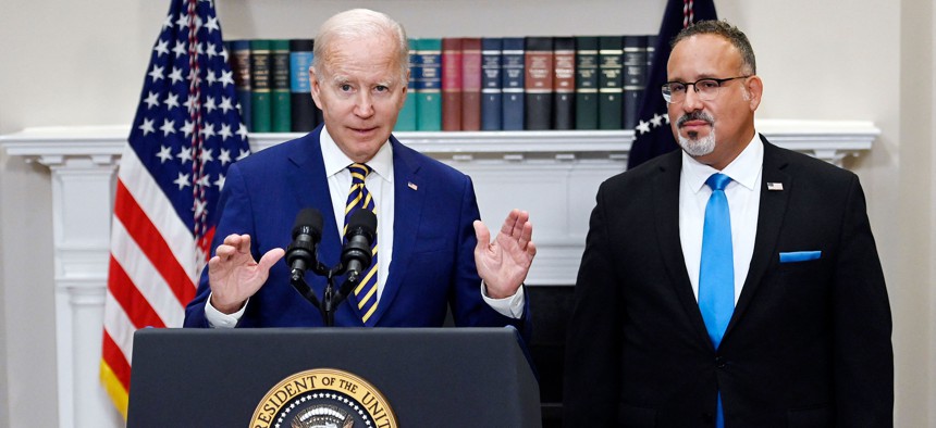 President Joe Biden speaking about student debt relief back in 20222 with Education Secretary Miguel Cardona.