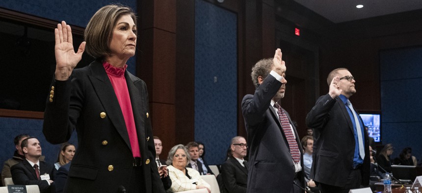 Iowa Gov. Kim Reynolds (left) at a recent House committee meeting. Reynolds has spearheaded a state-level Department of Government Efficiency, one of several state leaders to do so.