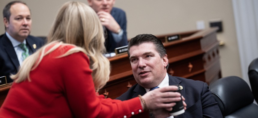 Rep. Jay Obernolte (seated right) speaks with a colleague during a recent hearing on Capitol Hill. The California Republican urged Congress to move on artificial intelligence laws, and preempt states "issue by issue."