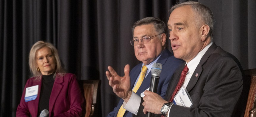 New York Comptroller Thomas DiNapoli (right) speaks during a recent event. DiNapoli dinged several state agencies in an audit and said they need more guidelines on how to use AI.