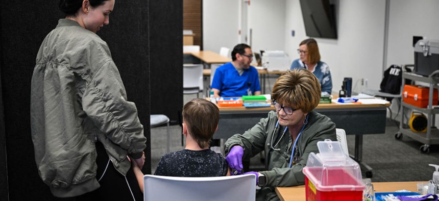 A member of the medical staff administers a dose of the measles vaccine to a child at a health center in Lubbock, Texas, on Feb. 27, 2025.