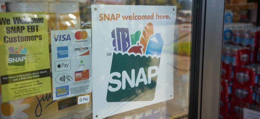 "SNAP welcomed here" sign is seen at the entrance to a Big Lots store in Portland, Oregon.