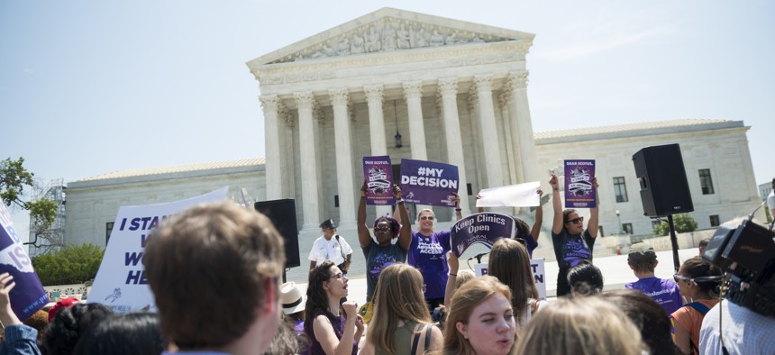 Abortion-rights supporters stand in front of the U.S. Supreme Court after the court, in a 5-3 ruling in the case Whole Woman's Health v. Hellerstedt, struck down a Texas abortion access law June 27, 2016..