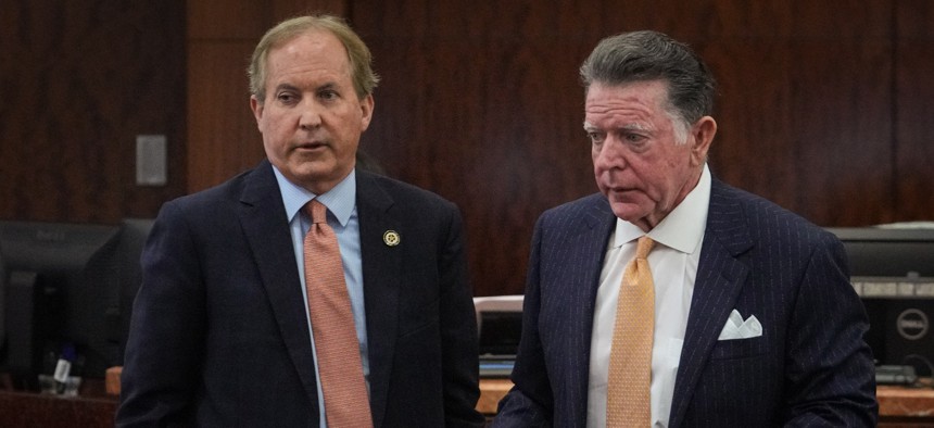 Texas Attorney General Ken Paxton (left) at a previous event. Paxton defended the state's age verification law in the Supreme Court and prevailed last week.