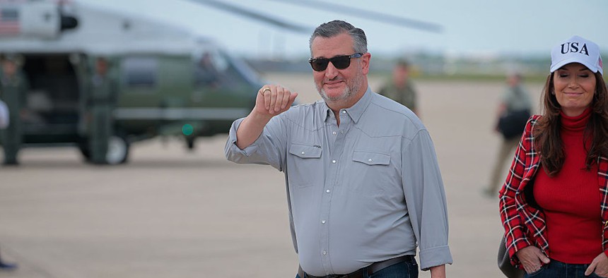 Sen. Ted Cruz (R-TX) waves as he arrives with President Donald Trump at Lackland Air Force Base before heading off to Kerrville, Texas, where they plan to visit with state and local leaders, first responders and victims of the flash flooding on July 11, 2025, in San Antonio, Texas.