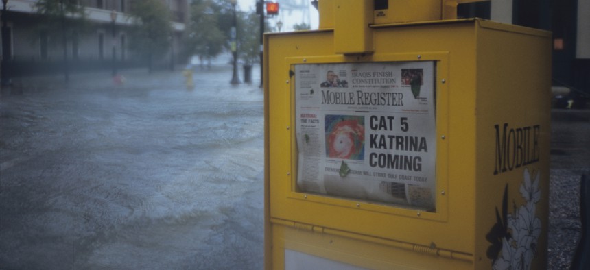 A newspaper warns of the oncoming disaster as Hurricane Katrina strikes Mobile, Alabama, with a 15-foot storm surge and winds of over 110 mph.