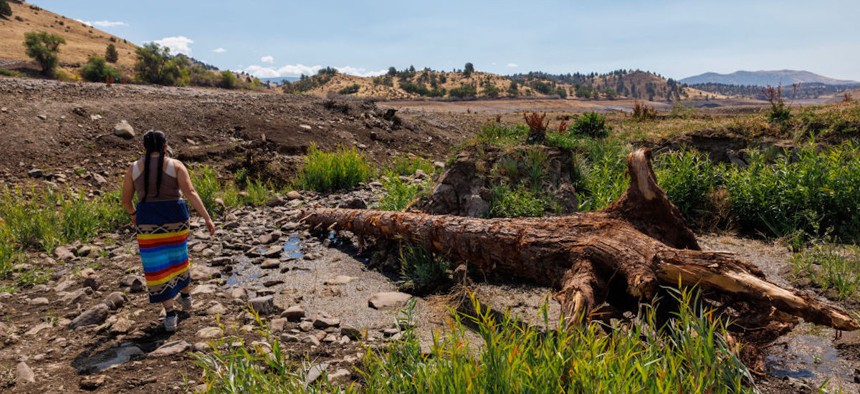 Brook Thompson a restoration engineer for the Yurok Tribe walks along Camp Creek which is being restored as an active tributary to the Klamath River on August 14, 2024, in Hornbrook, California.