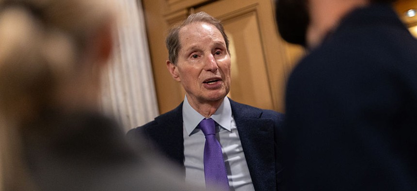  Sen. Ron Wyden, D-Ore., speaks with reporters as the Senate votes on government funding in Washington, DC on Nov. 9, 2025. Wyden and 39 Democratic colleagues sent letters to 19 states on Wednesday warning that state resident information managed by Nlets can be used by ICE to query driver license and registration information. 