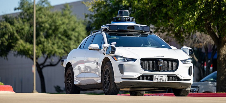 A Waymo vehicle exits a charging lot on Jan. 15, 2026, in Austin, Texas.