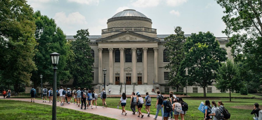 People walk on the campus of the University of North Carolina Chapel Hill on June 29, 2023, in Chapel Hill, North Carolina.