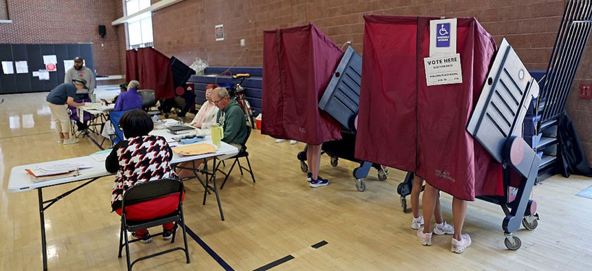 People cast their votes in the gymnasium of Sophie B. Wright Charter School in the Uptown neighborhood on May 16, 2026, in New Orleans, Louisiana.