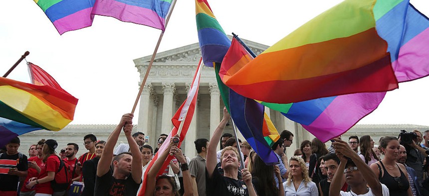 Supporters of same-sex marriage rejoice outside the Supreme Court in Washington, DC., after the U.S Supreme Court hands down a ruling regarding same-sex marriage on June 26, 2015.