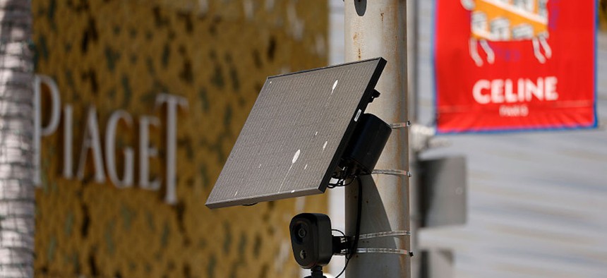 A Flock Safety camera is shown mounted to a light pole on Aug. 3, 2026 in Beverly Hills, California