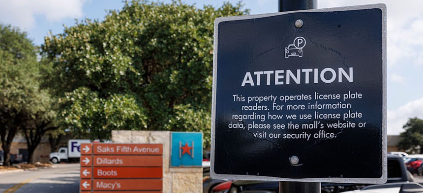 A sign notifies drivers that Flock Safety cameras monitor traffic entering and leaving North Star Mall along West Rector Drive in San Antonio on Friday, Aug. 7, 2026.