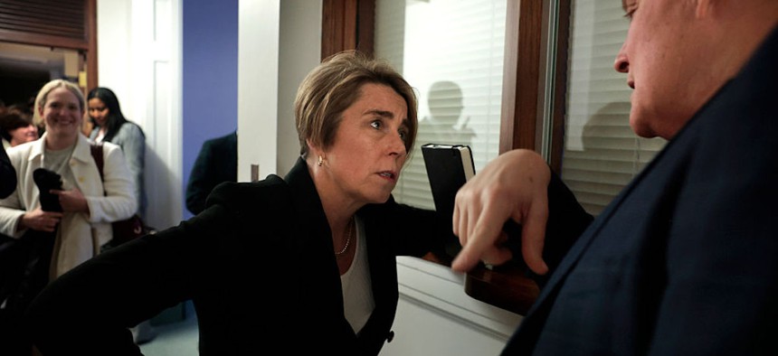 Massachusetts Governor Maura Healey talks with Sen. Michael Moore about the bill he cosponsored regarding artificial intelligence, following a campaign event on February 10, 2026.