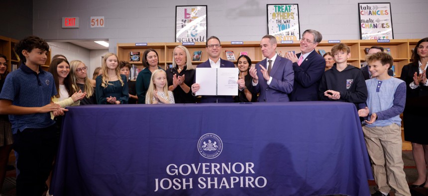Gov. Josh Shapiro signs a bell-to-bell school cell phone ban into law at the Central Bucks School District.