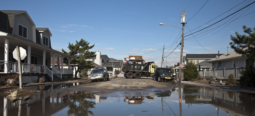 New York City Department of Transportation work crews assist in the clean-up efforts in Breezy Point, Queens, following Superstorm Sandy.