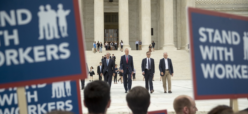 From left, Liberty Justice Center's Director of Litigation Jacob Huebert, Illinois Gov. Bruce Rauner, Liberty Justice Center founder and chairman John Tillman, and plaintiff Mark Janus walk out of the the Supreme Court on Wednesday.