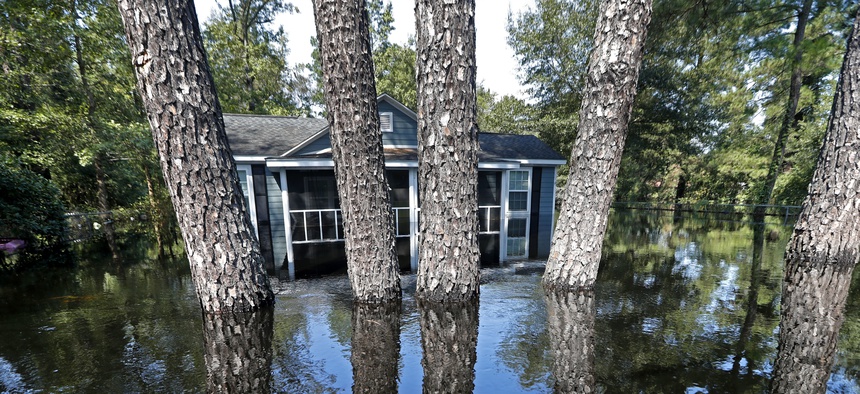 A house and pine trees are seen in South Carolina floodwaters in the aftermath of Hurricane Florence on Sept. 21, 2018.