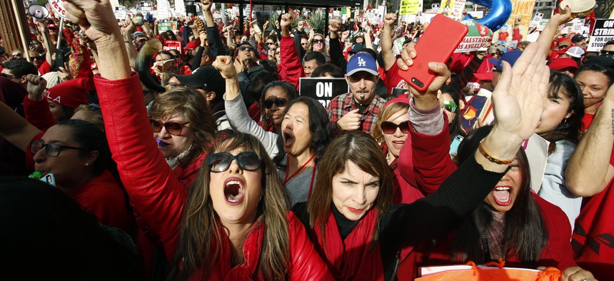 Educators rally as a strike against the Los Angeles Unified School District entered its fifth day outside City Hall in Los Angeles Friday, Jan. 18, 2019.