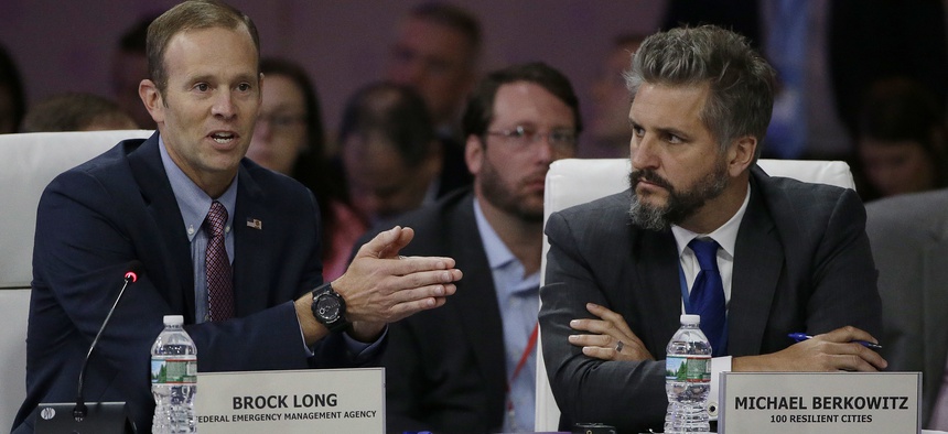 Former FEMA Administrator Brock Long, left, addresses a session entitled "Preparing for the Extreme: Building Resilient Communities" as 100 Resilient Cities President Michael Berkowitz, right, looks on during a 2017 National Governors Association meeting.