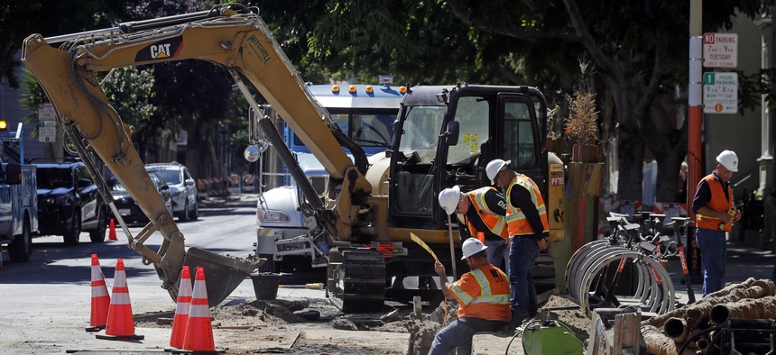 A Pacific Gas & Electric crew working in San Francisco. San Francisco officials are offering to buy Pacific Gas & Electric's power lines and other infrastructure in the city for $2.5 billion.