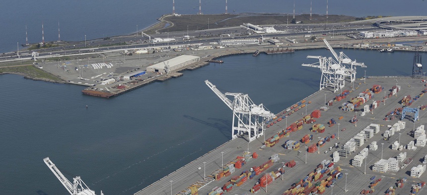 The former Oakland Army Base pier at left and the Port of Oakland at lower right in Oakland, Calif., as seen in February 2016. A developer is seeking to build a bulk cargo terminal that would handle coal and other goods at the former Army base site.