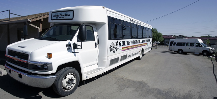 Buses parked at the main terminal at Corre Caminos Transit await their drivers to go on various routes in May 2007, in Silver City, N.M.