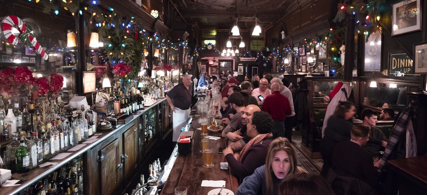 In this Dec. 27, 2019 photo, customers mingle in New York's Old Town Bar. Once a speakeasy during Prohibition, the Old Town Bar opened in 1892.