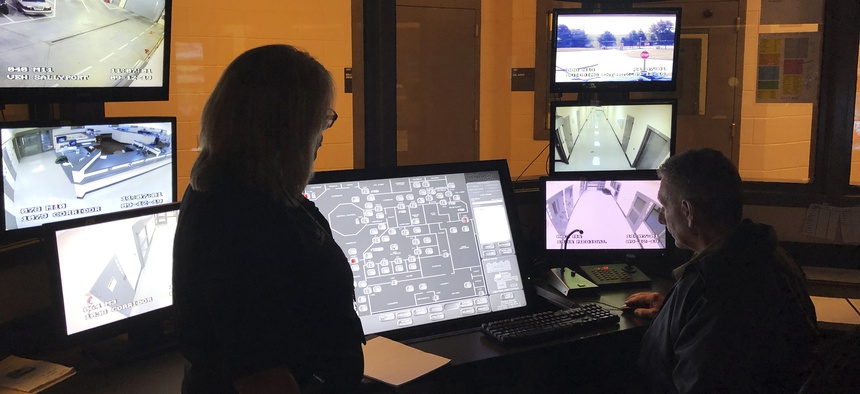 Jackson County Sheriff Janis Mangum stands in a control room at the county jail, in Jefferson, Georgia. A ransomware attack last year took down the office’s computer system. Local governments and agencies are increasingly becoming targets of such attacks.