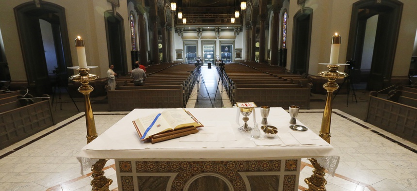 The Altar is prepped for a live streamed mass that Bishop Barry C. Knestout will conduct in an empty sanctuary at the Cathedral of the Sacred Heart Sunday April 12, 2020, in Richmond, Va., due to COVID-19.