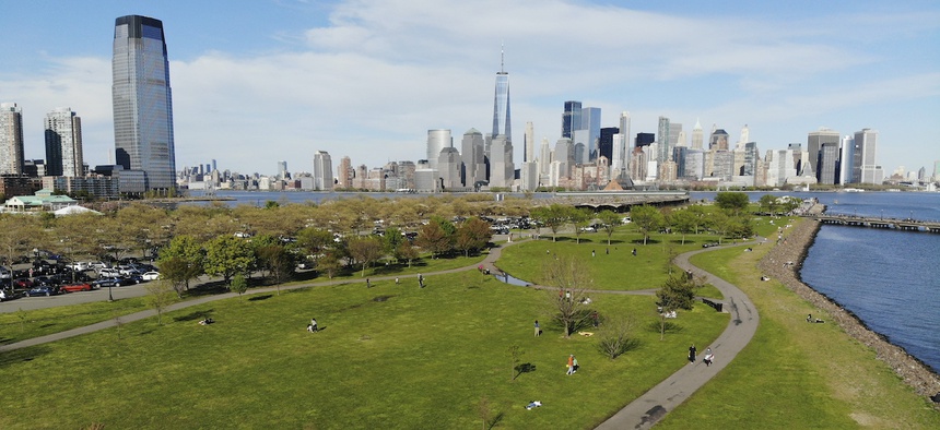 People enjoy the good weather while keeping their distance from one another at Liberty State Park in Jersey City, N.J., Saturday, May 2, 2020. Gov. Phil Murphy said early reports of behavior at the state's newly reopened parks were "so far, so good."